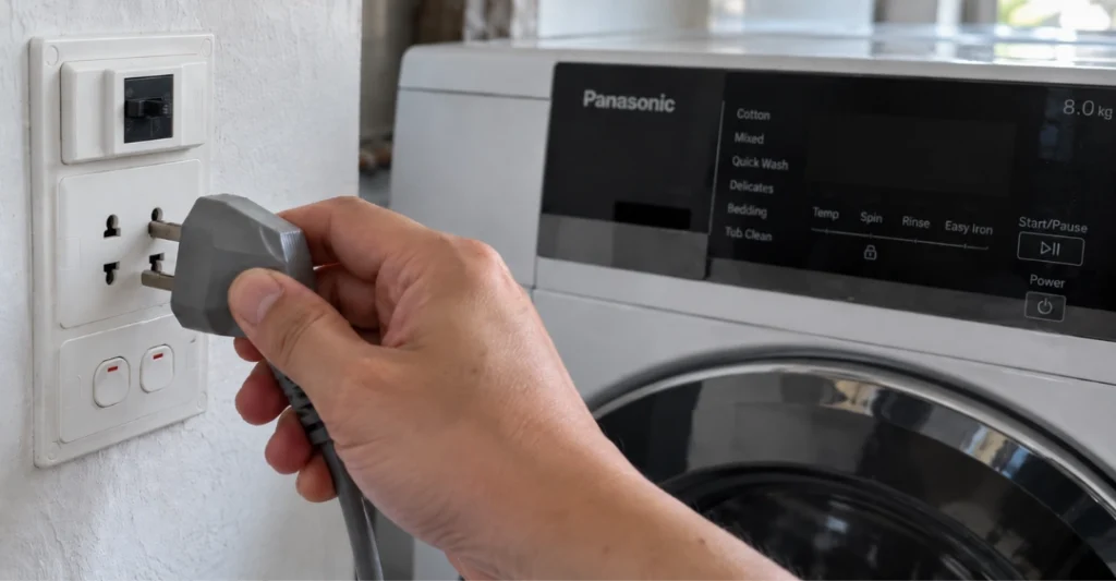 Rút phích cắm điện máy giặt Panasonic hiển thị lỗi H07 để kiểm tra an toàn
